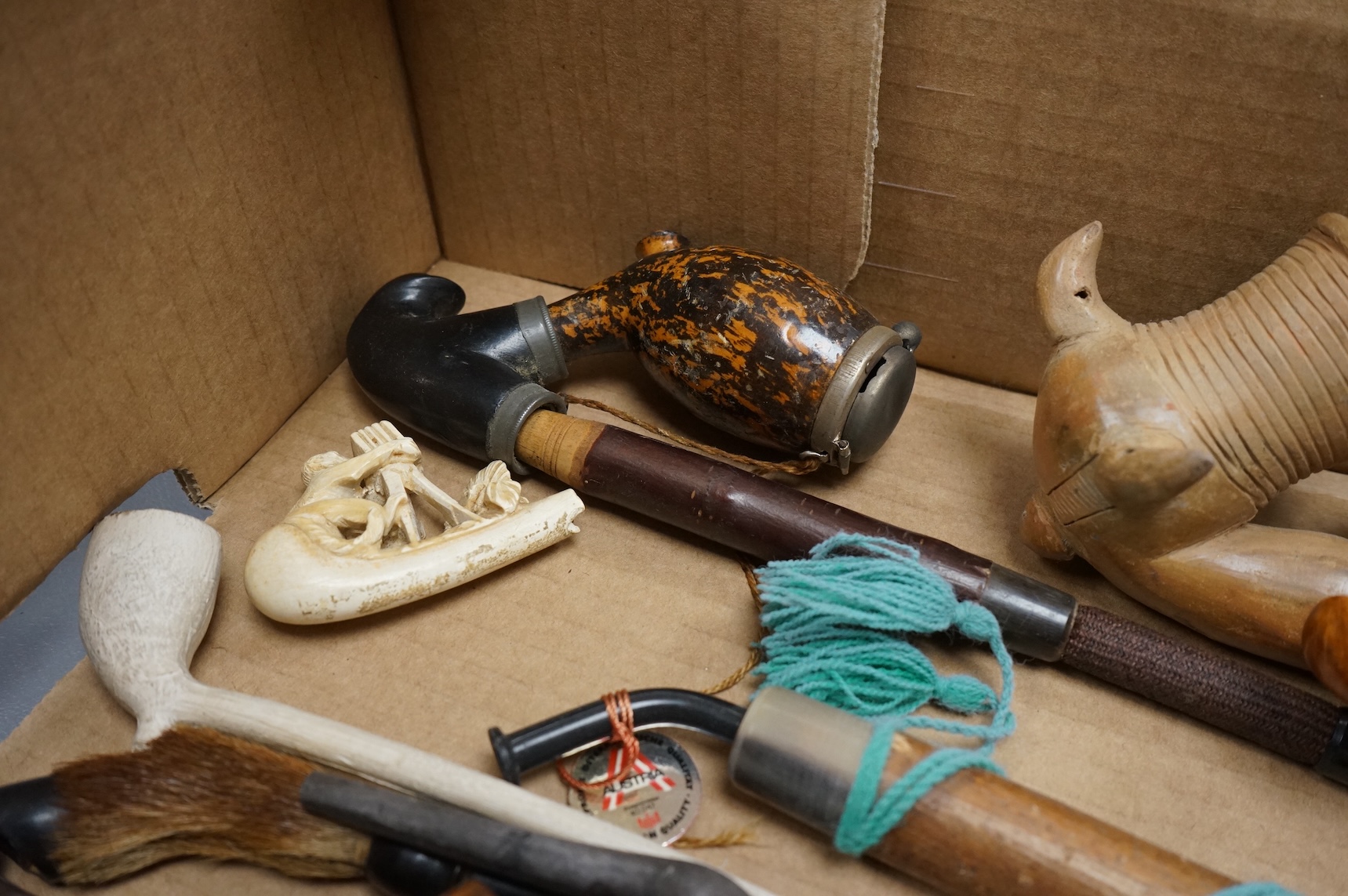 A group of fifteen novelty pipes to include treen, clay and ceramic examples
